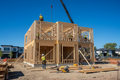 Custom new home construction with wood framing in a Canadian suburb
