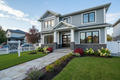 Exterior home renovation with new siding, windows and landscaping